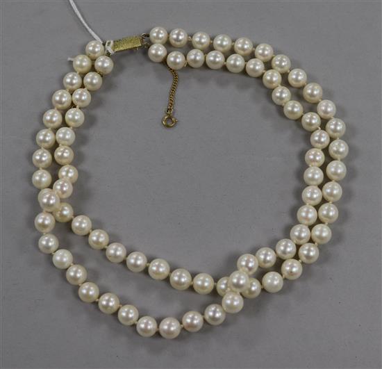 A double strand cultured pearl choker necklace, with yellow metal rectangular clasp, 38cm.